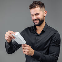 Thumbnail for Man smiling while opening a gift box of the Classic Photo Bracelet by Brother & Sisters.