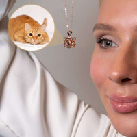 Thumbnail for Woman wearing a Meow Photo Necklace with a projection of her orange cat, featuring Brother & Sisters brand.