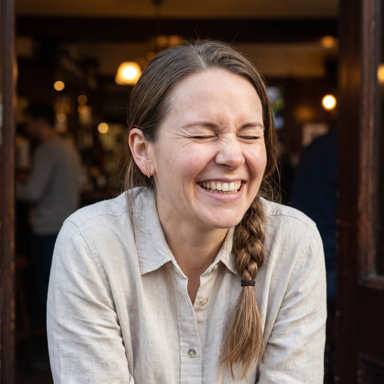 Woman laughing, wearing the rose gold stud earrings | SKU: 42008-rose-gold