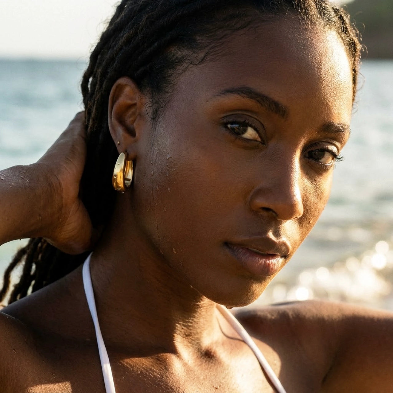 Chunky Dome Hoops in Gold, worn in the sea, wet skin | SKU: 41005-gold