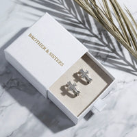 Thumbnail for Pave Cross Huggie Hoops in Silver, in the gift box | SKU: 41006-silver