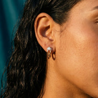 Thumbnail for Pear Crystal Huggie Hoops in Gold, close-up on the earlobe | SKU: 41007-gold