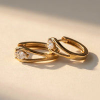 Thumbnail for Pear Crystal Huggie Hoops in Gold, product photo | SKU: 41007-gold