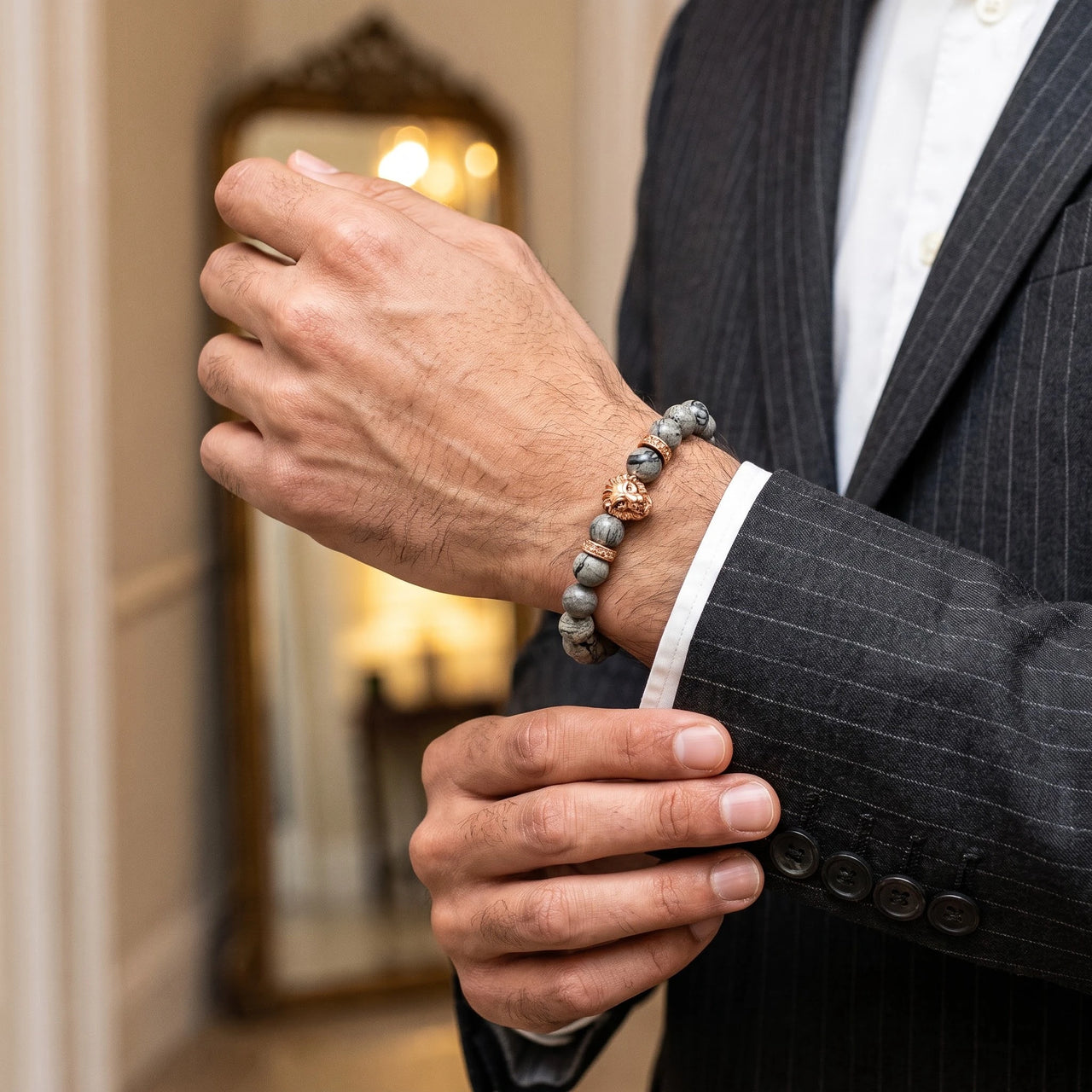 Rose Gold Lion & Grey Stones Bracelet – worn with a shirt cuff | Brother & Sisters | SKU: 20866222-rose-gold-XS-14-15, 20866222-rose-gold-S-16-17, 20866222-rose-gold-M-18-19, 20866222-rose-gold-L-20-21, 20866222-rose-gold-XL-22-23