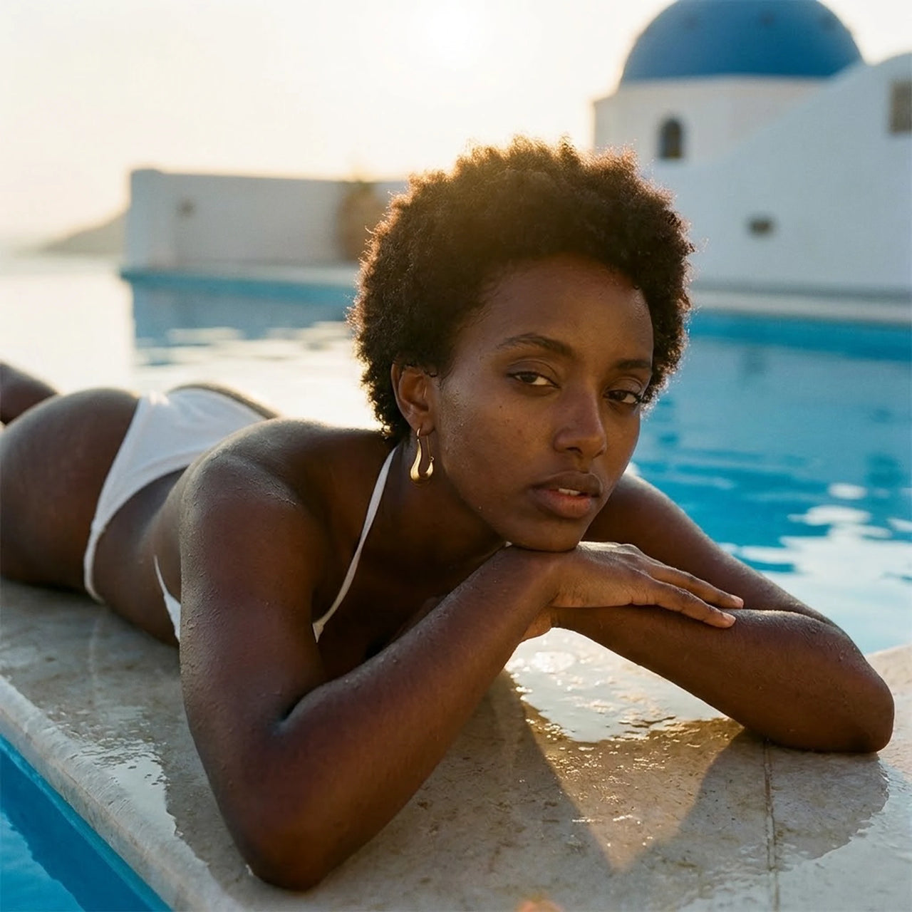 Sculpted Crescent Drops in Gold, worn by a pool in Santorini | SKU: 41008-gold