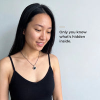 Thumbnail for Woman wearing the silver heart pendant, black on the outside, only she knows the photo inside | SKU: TPH-CHTN-SILVER-SMALL
