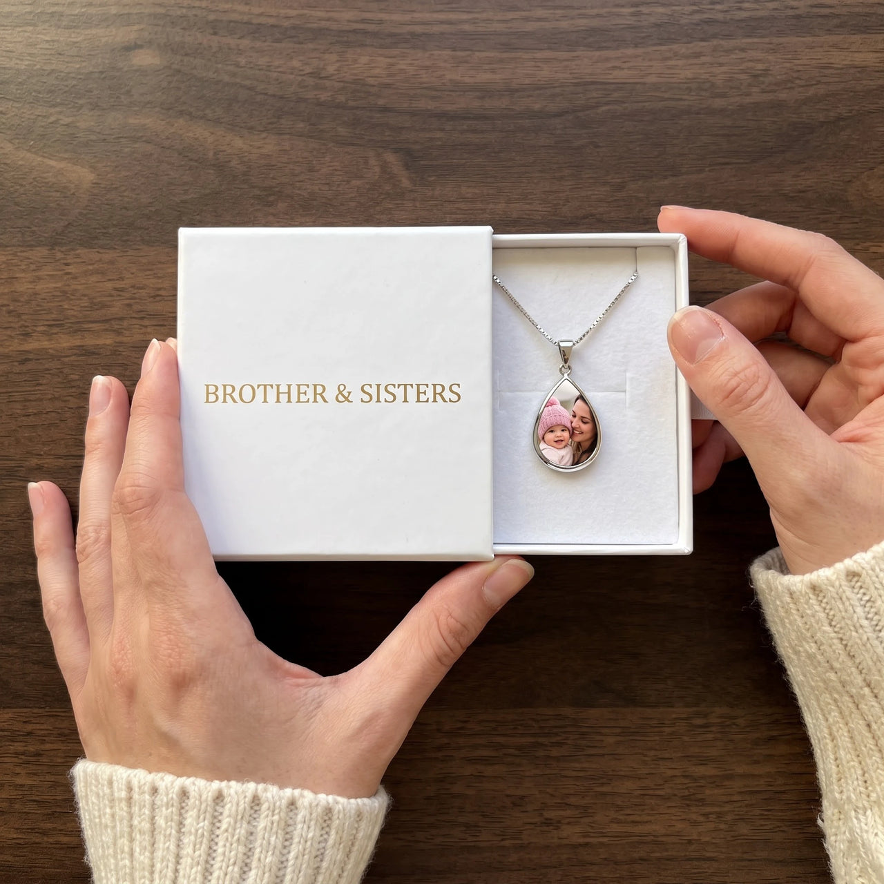 The silver drop photo necklace with a mother and baby photo in the Brother & Sisters gift box | SKU: TPH-DRPN-SILVER
