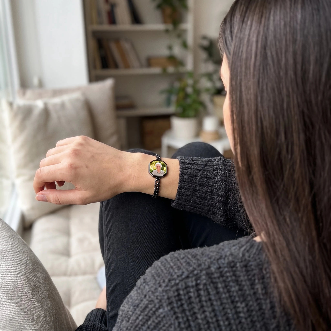 Woman looking at her grandmother's photo in the black octagon photo bracelet | SKU: TPH-OCTB-BLACK-18