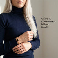 Thumbnail for Woman wearing the gold bracelet with its black octagon charm, only she knows the photo inside | SKU: TPH-OCTB-GOLD-18