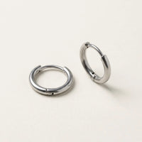 Thumbnail for Tiny Huggie Hoops in Silver, product photo | SKU: 41002-silver