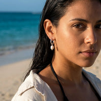 Thumbnail for Twisted Pearl Drop Hoops in Silver, worn on the beach | SKU: 41004-silver